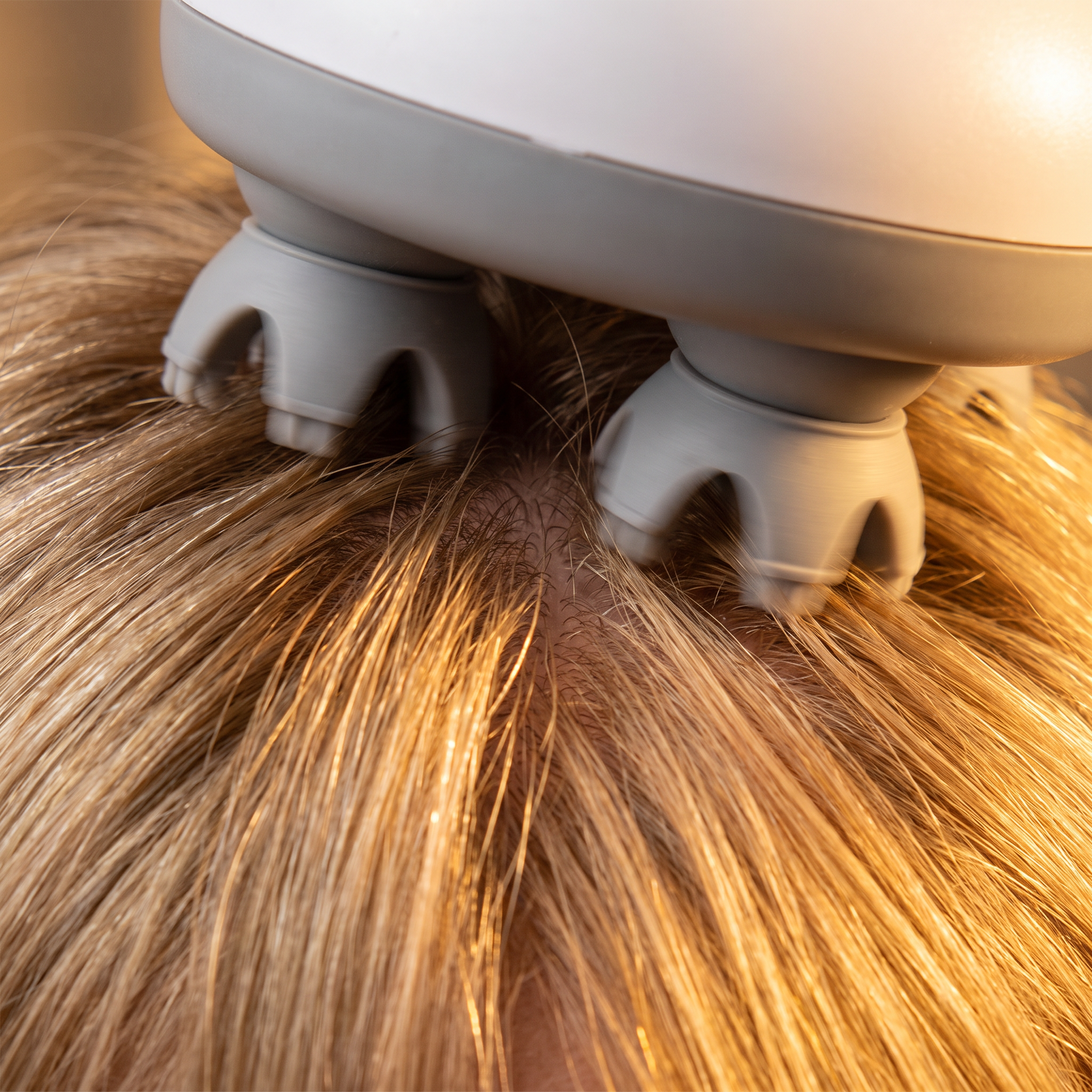 Macro of the kneading heads working through hair